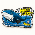 Styled studio image of Whale Alert die-cut sticker with blue business whale, yellow lettering and tiny trader in a boat